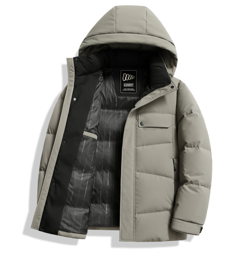 A light sage green puffer jacket partially unzipped showing black interior lining with Element brand label and technical construction