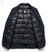 Open navy wool blazer showing black quilted down interior lining with subtle brand pattern and sheep logo label