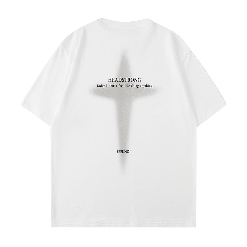 White oversized tee displayed flat against white backdrop. Features large cross graphic with "HEADSTRONG" text and "Today I don't feel like doing anything"