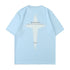 Light blue oversized tee displayed flat against white background. Features white cross graphic print with "HEADSTRONG" and "FREEDOM" text details