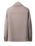 Back view of beige wool jacket on wooden hanger showing clean lines and tailored construction
