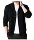 Black knit cardigan with shawl collar and button front, styled with white t-shirt and wrist watch, showing classic cable knit detailing