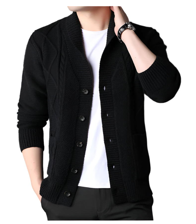Black knit cardigan with shawl collar and button front, styled with white t-shirt and wrist watch, showing classic cable knit detailing