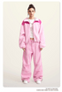 Pink fleece jacket with darker pink color-block shoulders and full zip