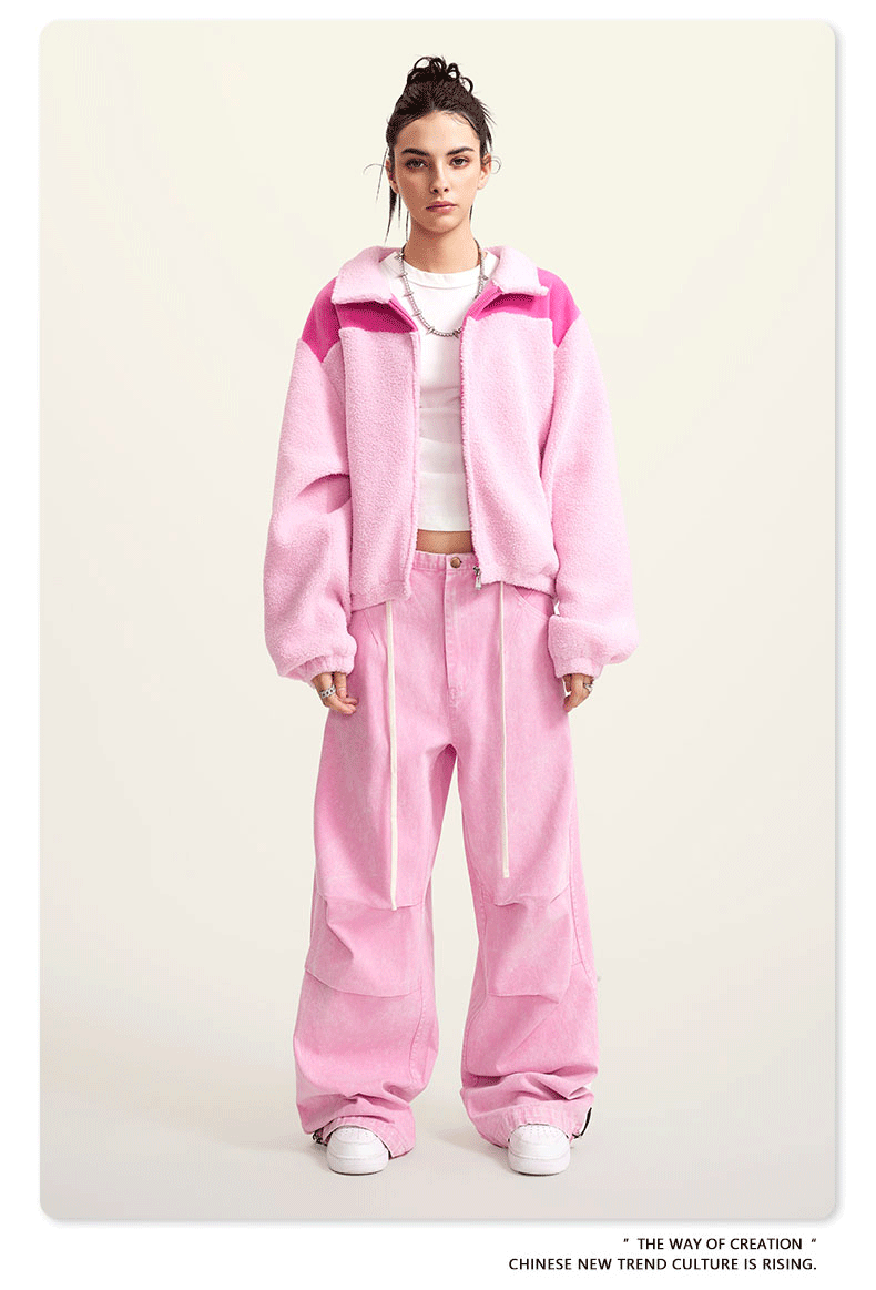 Pink fleece jacket with darker pink color-block shoulders and full zip
