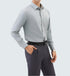 A model is wearing a light gray dress shirt with charcoal trousers and black belt. One hand in pocket showing silver watch