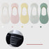 Five pastel no-show socks in white, pink, yellow, gray, and mint green. Color indicators and grip detail shown below