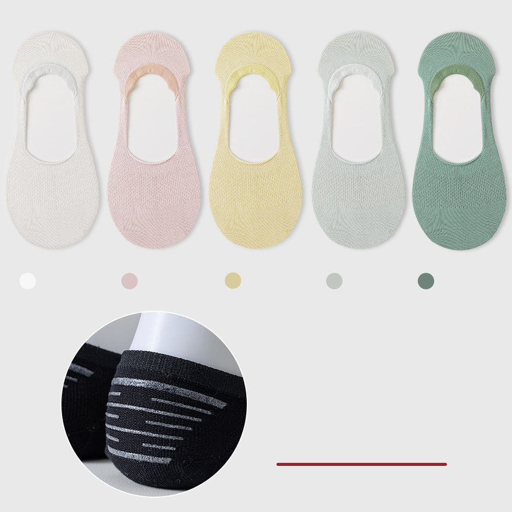 Five pastel no-show socks in white, pink, yellow, gray, and mint green. Color indicators and grip detail shown below