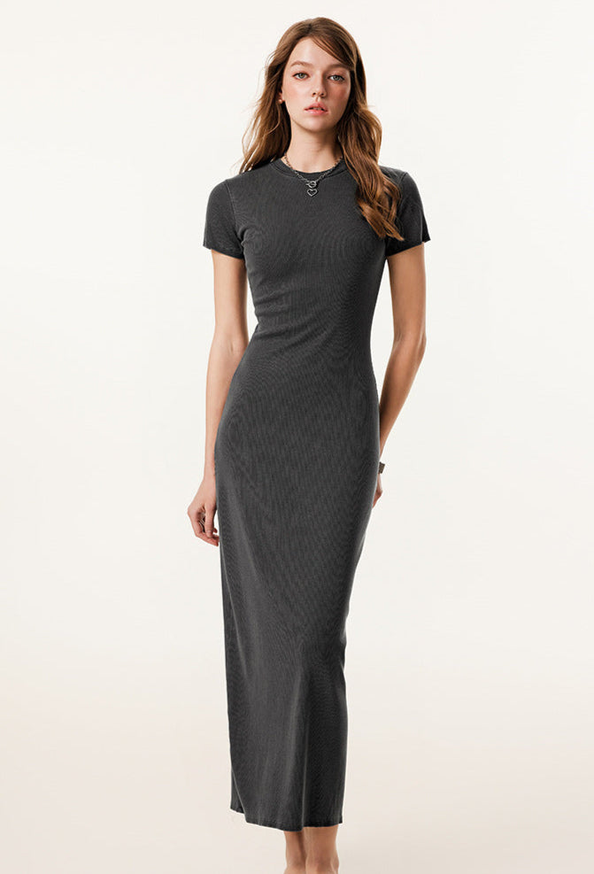 A dark grey short-sleeved maxi dress with a bodycon fit, displayed on a neutral textured background.