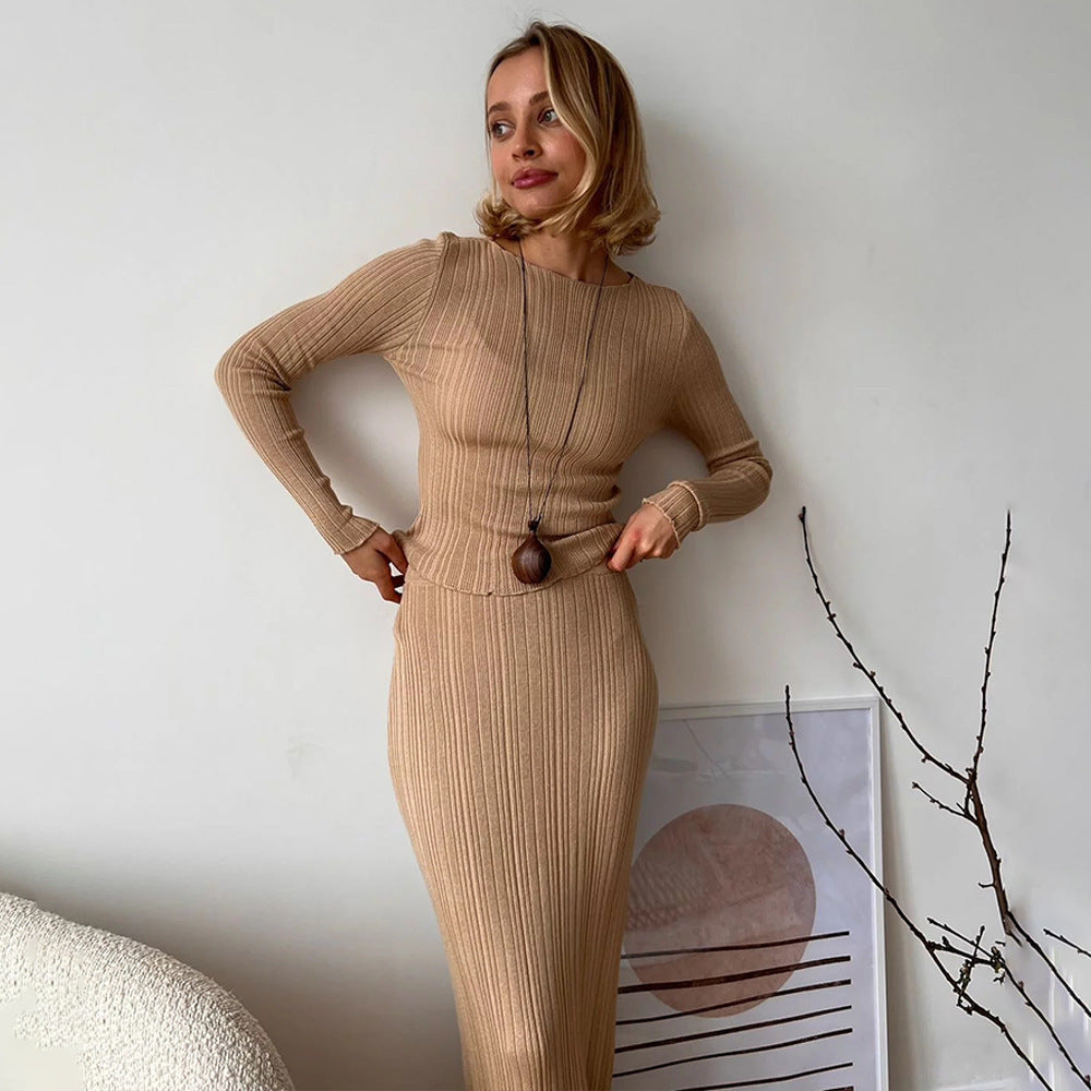 Beige ribbed knit co-ord set with pendant necklace styled against minimalist white wall decor, modern fashion