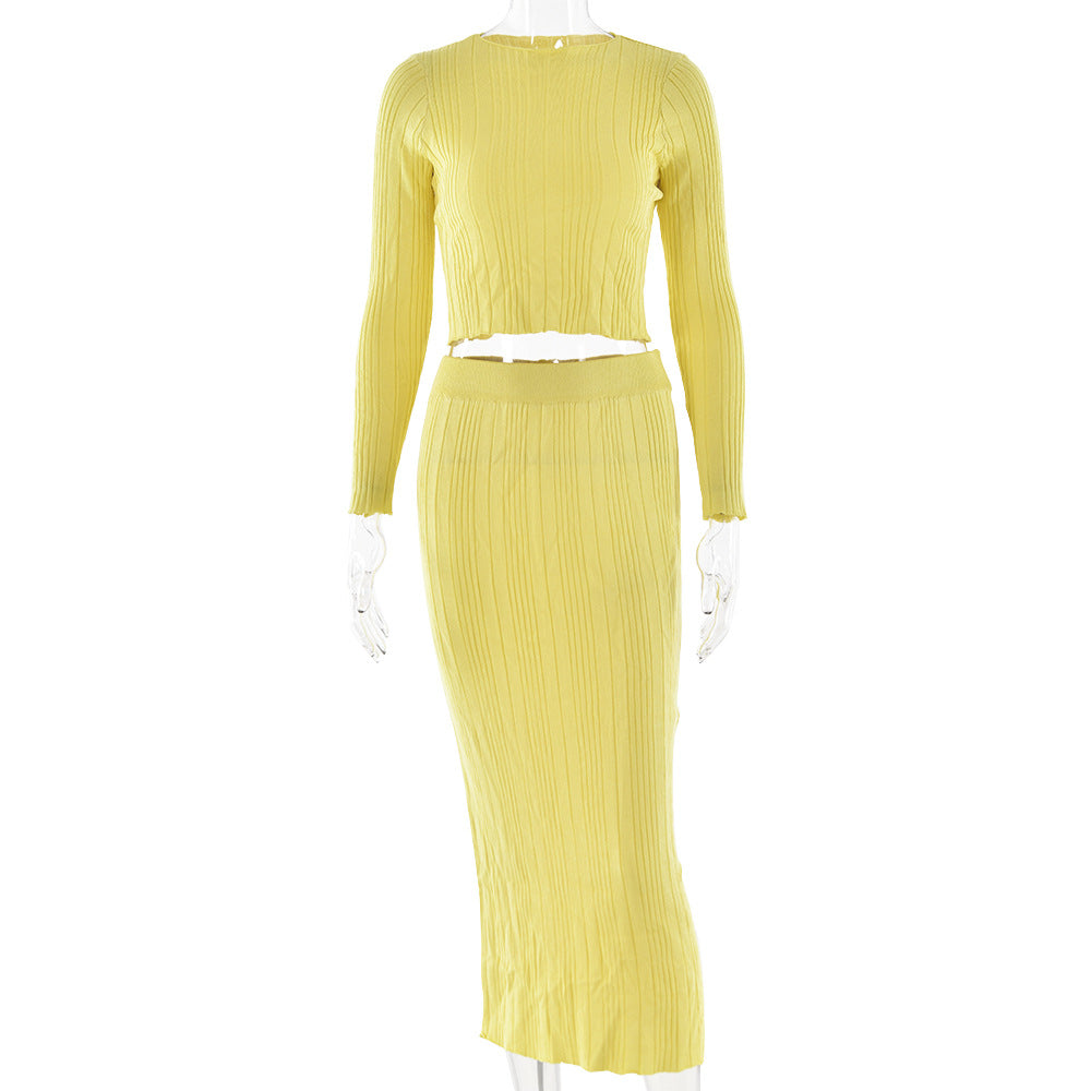 Pale yellow ribbed two-piece set with crop top and maxi skirt on mannequin, minimalist sustainable fashion