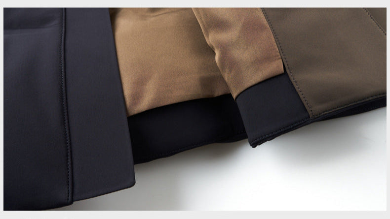 Zoomed-in view of the coat’s inner lining, displaying the contrast between the black exterior and brown interior fabric