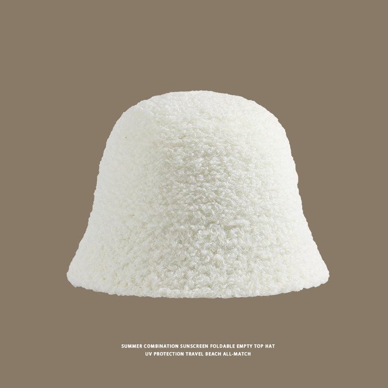 White fleece bucket hat with a soft, textured design for sun protection and casual styling