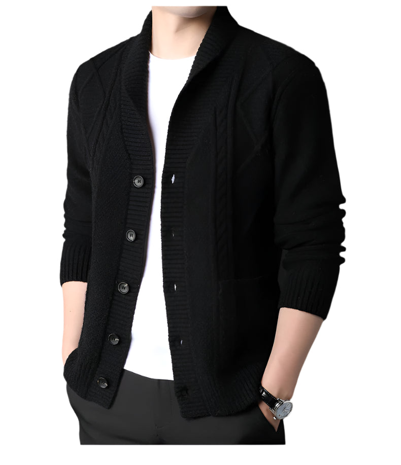 Front view of black button-up cardigan with geometric cable knit pattern, shown with white undershirt against neutral background