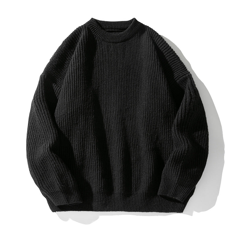 Black ribbed knit sweater with crew neck and dropped shoulders, product photo