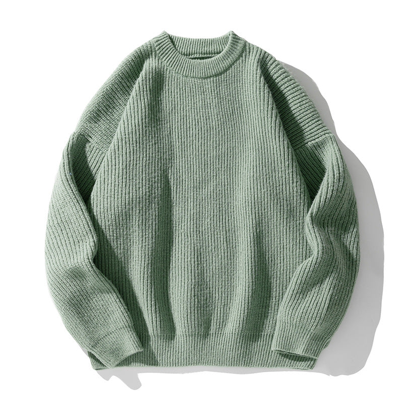 Sage green oversized sweater showing ribbed texture detail and relaxed fit