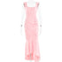 A pink jacquard evening gown with ruched detailing and fishtail hem displayed on mannequin against white background