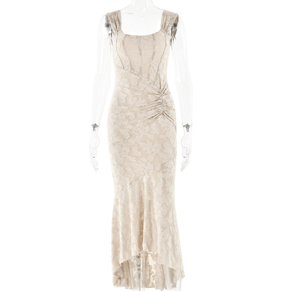 A beige jacquard formal dress with side gathering and high-low hemline displayed on mannequin against white background