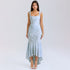 A model is wearing a light blue textured gown with corset bodice, ruched waist and high-low hemline, posing against white background