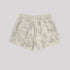 Light beige cotton shorts with elastic waistband and subtle gray wash pattern on light background
