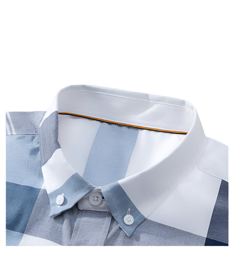 Close-up of shirt collar detail showing button placement and premium fabric with orange trim inside