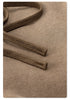 Detail of brown braided drawstring cord texture on taupe sweatpants fabric