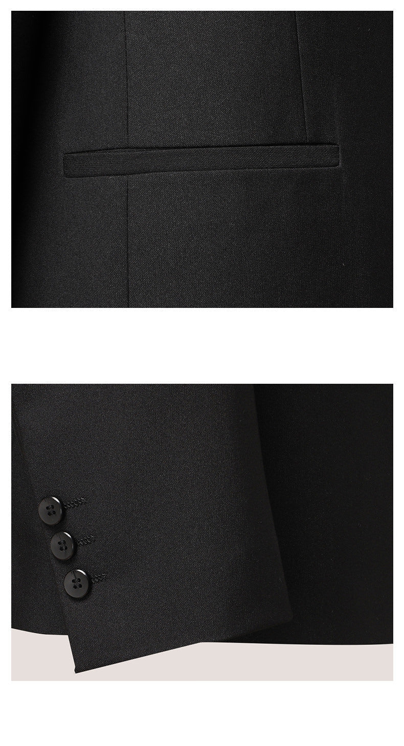Close-up of suit pocket detail and fabric texture, showing the clean, minimal design of the jet pocket