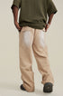 Rear view of model in olive t-shirt and beige wide-leg pants with visible back pockets