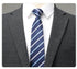 Close-up of suit lapel with white shirt and navy/light blue striped tie showing fabric texture