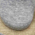 Close-up texture of heather gray cotton blend sock fabric on burlap background