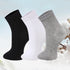 Set of three ankle socks in black, white, and gray against a cotton plant background