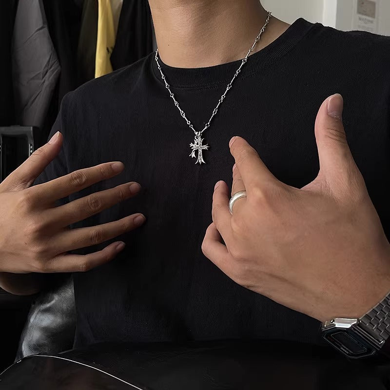 Titanium Steel Gothic cross pendant necklace styled on model wearing black t-shirt, showing pendant length and chain detail against dark fabric