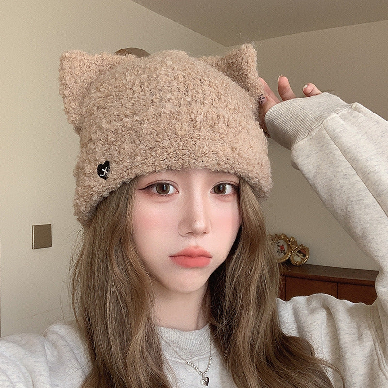 Close-Up of Beige Cat Ear Beanie Hat – Warm fuzzy beige beanie hat with cat ear design, adding a playful touch to any outfit