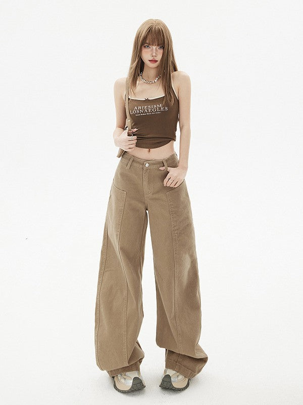 Front view, full-body shot of wide-leg khaki jeans with curved seams.
