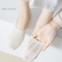 Pure cotton white no-show socks shown on feet with mesh ventilation detail and non-slip design