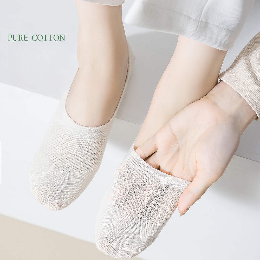 Pure cotton white no-show socks shown on feet with mesh ventilation detail and non-slip design