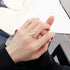 Gold lightning bolt statement ring displayed on hand with black sleeve