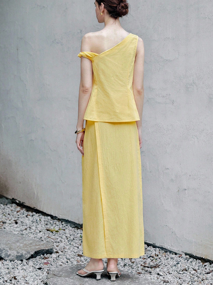 Back view of yellow two piece skirt set with sleeveless one shoulder top