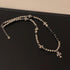 Titanium Steel Cuban chain necklace with cross pendants on dark surface