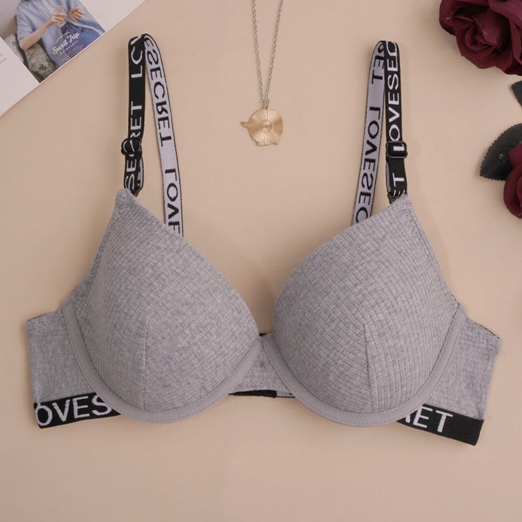 Heather gray push-up bra featuring branded elastic straps and textured fabric with logo band detail