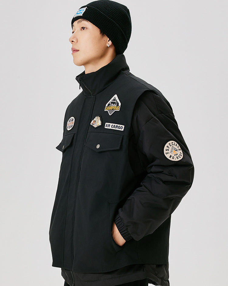 Side view of black military-style jacket with embroidered patches, showing camping logo and special number badge on sleeve