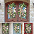  Pair of symmetrical Easter wreaths with burlap bows, pastel flowers, and wooden bunny accents, hanging on double wooden doors.