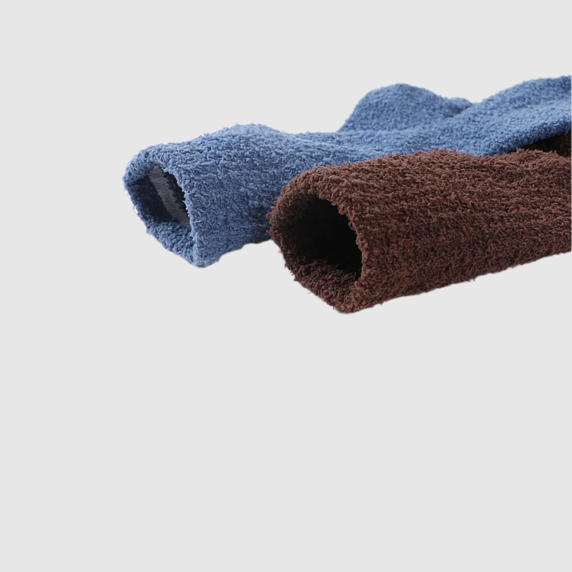 Two fluffy socks in blue and brown, showcasing plush, textured fabric with a soft, fuzzy appearance