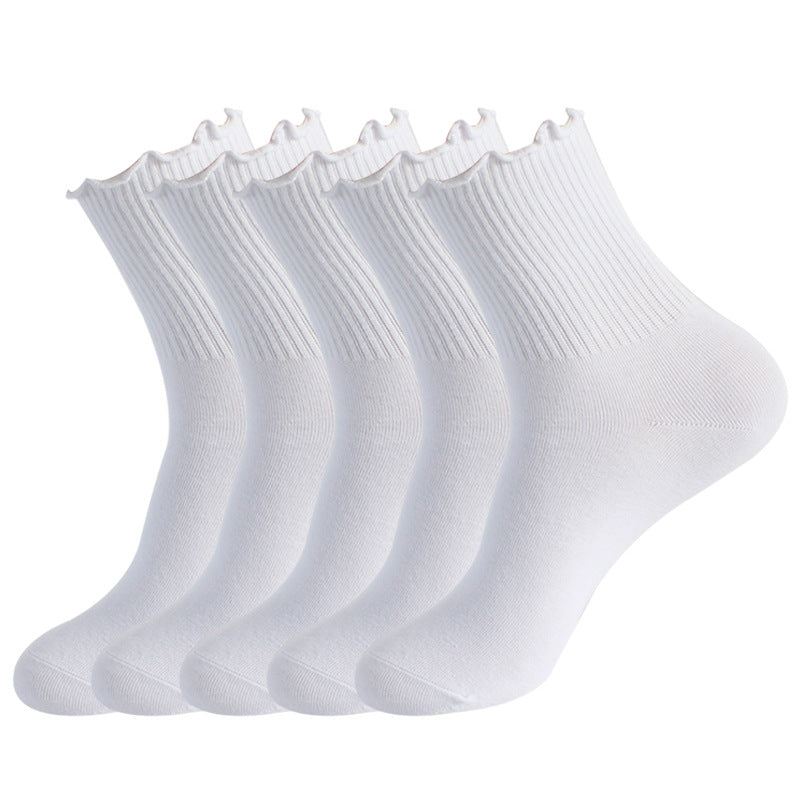 Five pairs of white ankle socks with ribbed cuffs and scalloped edges displayed in a row against white background
