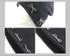 Detailed close-up of a dark gray beanie showing pearl-studded bow decorations from multiple angle