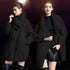 Model in black cocoon puffer coat shown from two angles, styled with black sweater, leather skirt and tall boots