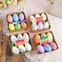 Four gift boxes with Easter egg painting kits, including colorful eggs, white eggs with printed designs, and a set of markers.