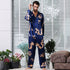 Navy blue silk men's pajama set with golden dragon print, showcasing classic button-up style and full-length pants