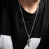 Titanium Steel box chain necklace with ornate cross pendant, styled with black t-shirt