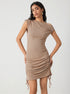 Khaki bodycon dress with one-shoulder neckline and ruched side detail, paired with statement gold earrings
